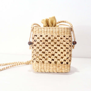 تالاني – حقيبة كروس بودي من القش المنسوج يدوياً