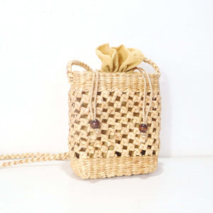 تالاني – حقيبة كروس بودي من القش المنسوج يدوياً