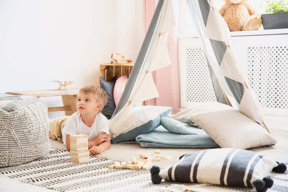kid in boho nursery room