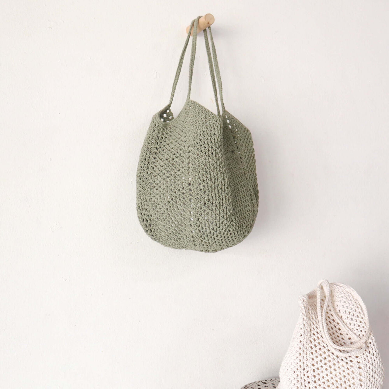 Olive — lightweight straw shoulder bag for warm-weather styling