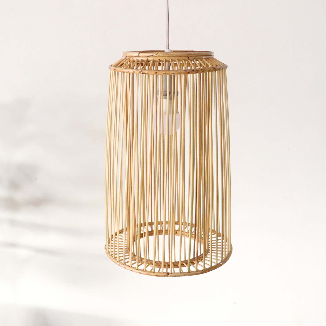 SANGSAN — handwoven rattan pendant light shade with an open weave that diffuses soft golden light