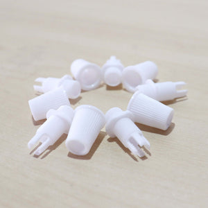 White Cord Grips Lampshade Holder – Plastic Screw Style Cord Grip (20 pcs.) arranged in a circular formation.