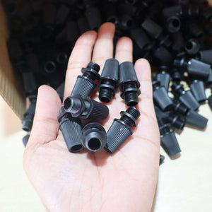 Black Cord Grips Lampshade Holder – Plastic Screw Style Cord Grip (20 pcs.) in hand, showcasing durable lighting accessories.