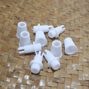 White Cord Grips Lampshade Holder – Plastic Screw Style Cord Grip (20 pcs.) arranged on woven surface.