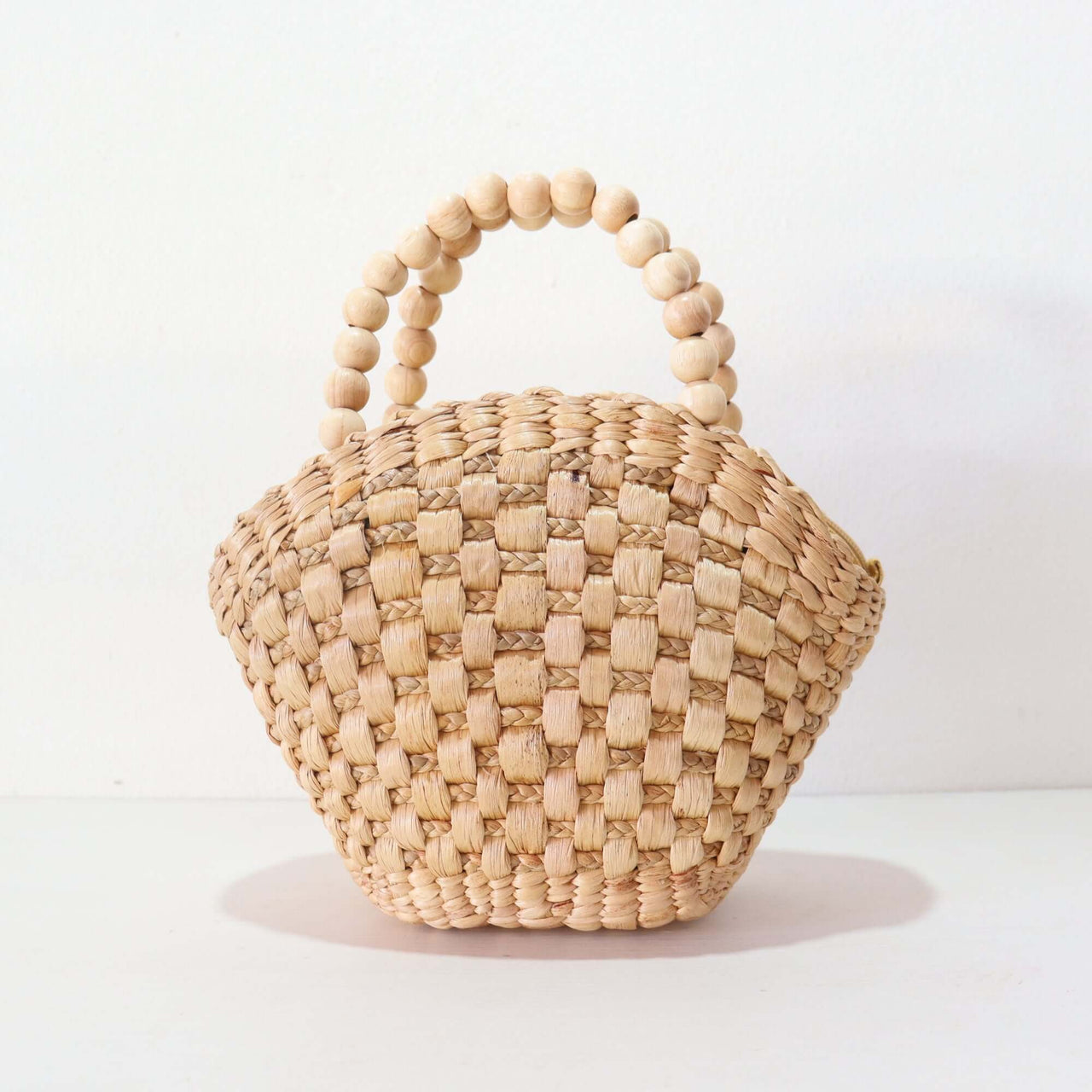 NAVALEE handwoven straw handbag with natural woven texture, by Thai artisans
