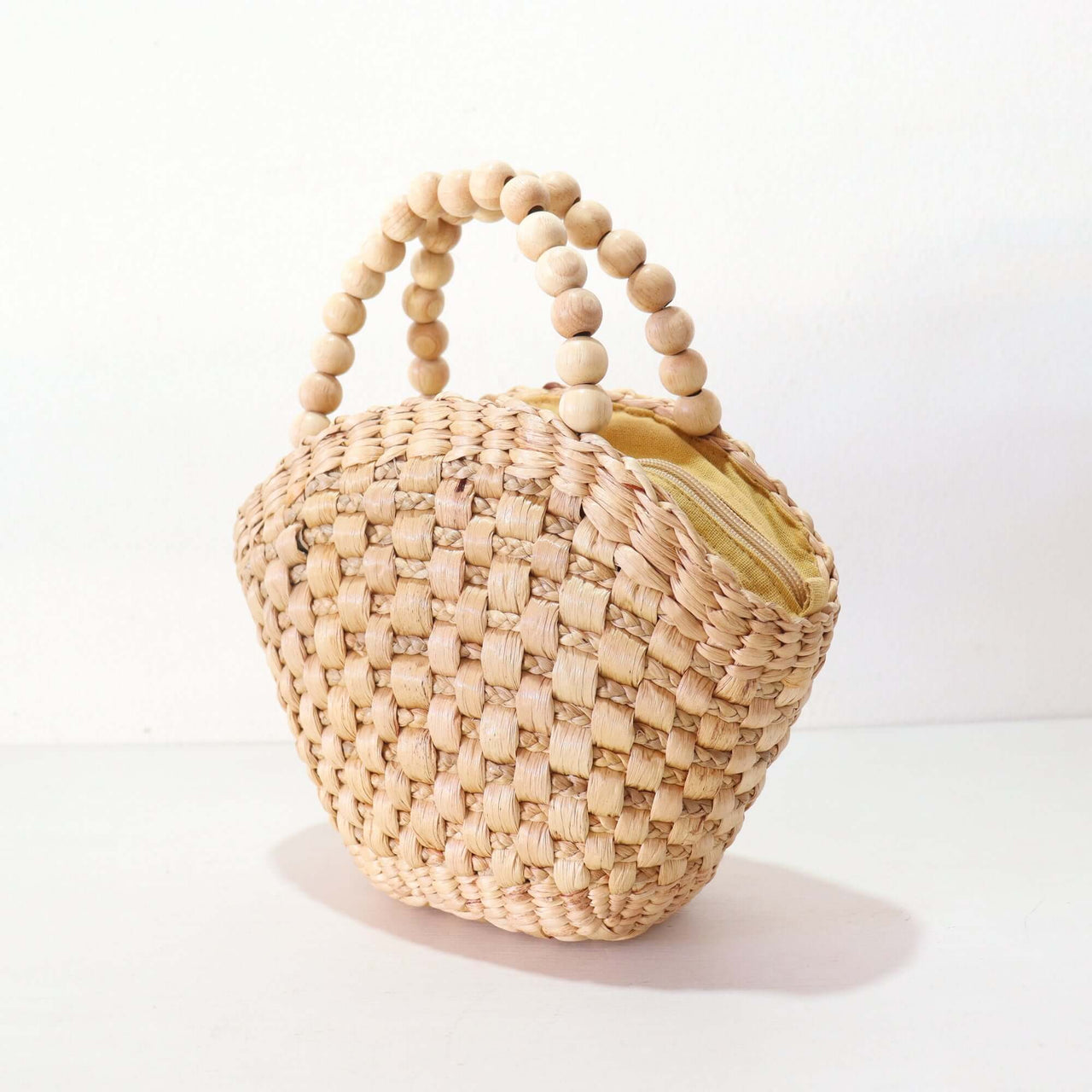 NAVALEE — handwoven straw handbag with a soft, natural weave