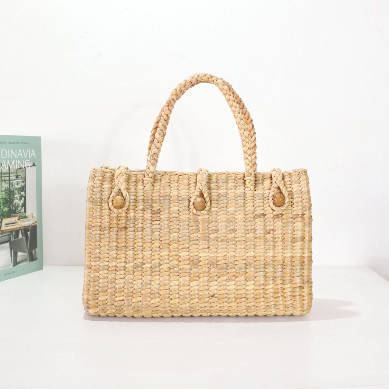 Handwoven seagrass handbag with natural woven texture, by Thai artisans