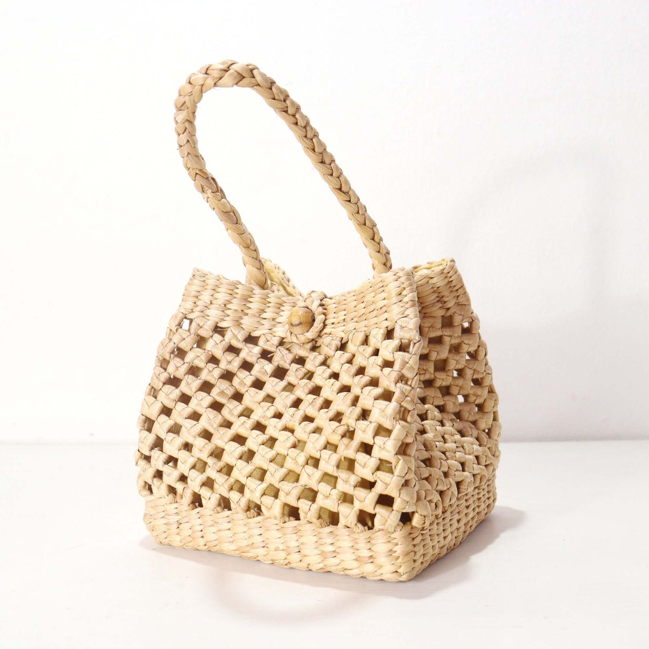 Tanid — natural straw handbag with an artisan woven finish