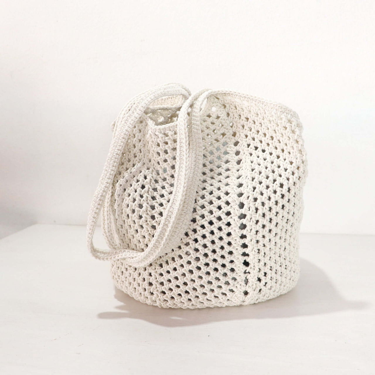 White Crochet Shoulder Bag crafted with a delicate weave and clean white tone, perfect for everyday style.