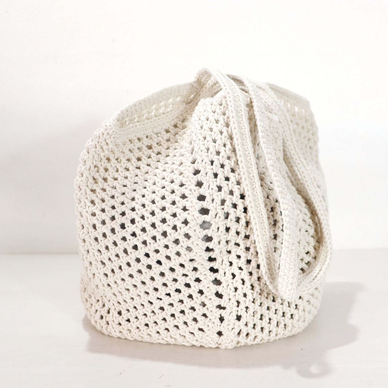 White Crochet Shoulder Bag showcasing delicate weave and clean white tone, perfect for everyday style.