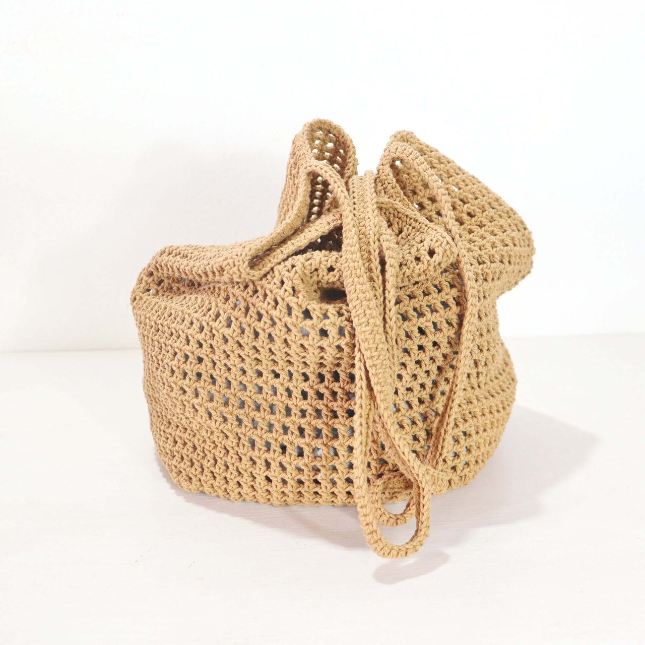 Brown - Crochet Shoulder Bag showcasing a soft texture and warm brown tone, perfect for effortless elegance in everyday styling.
