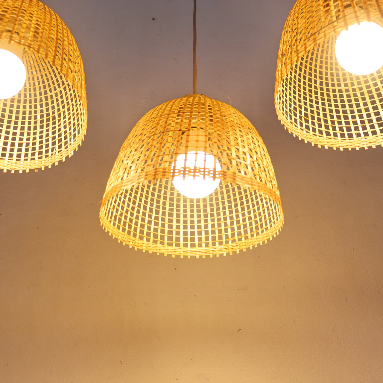 SAMA — bamboo pendant light shade above a dining table for warm ambient glow