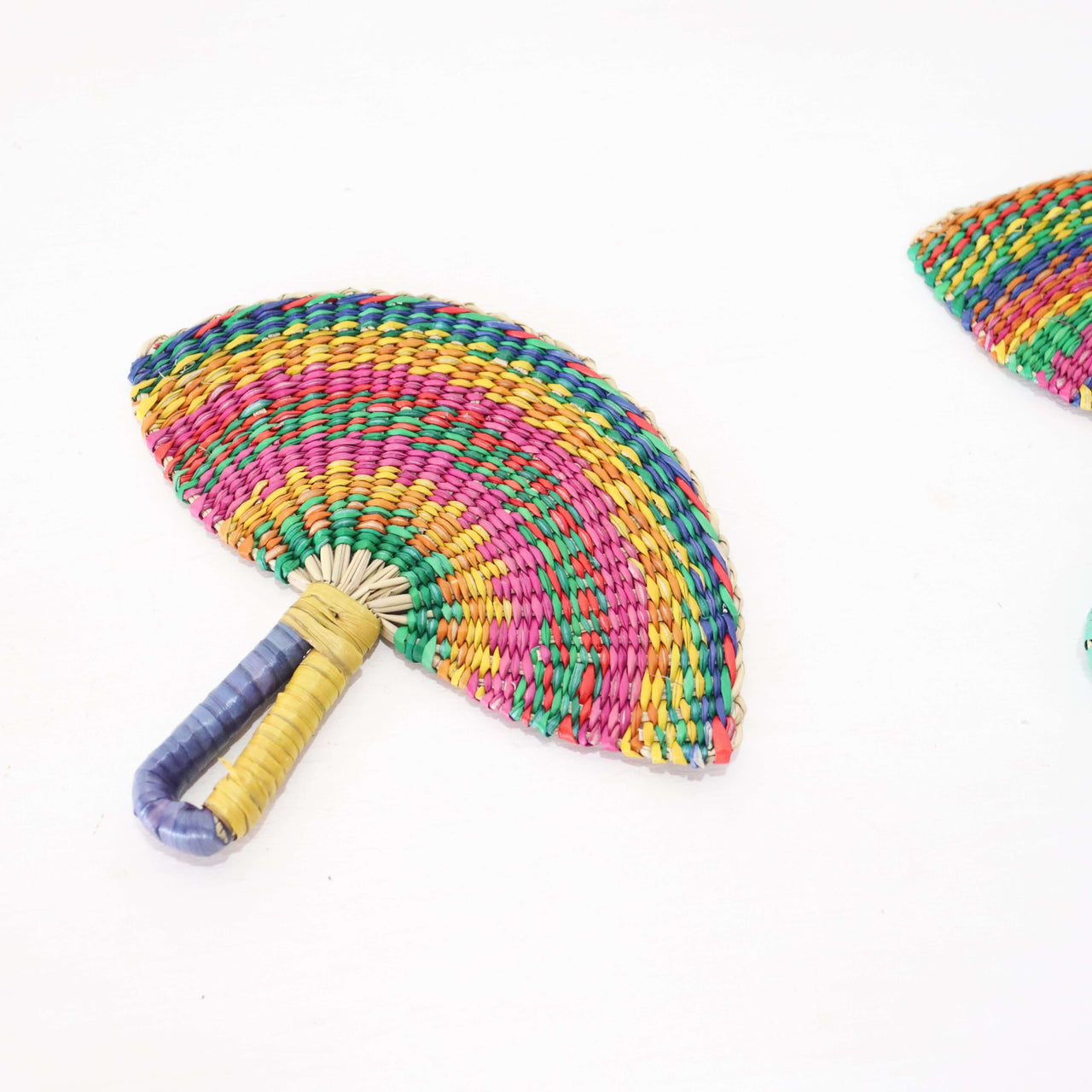 LA LA VAN – Handwoven Fan (Wall Hanging & Hand Fan) featuring vibrant multicolour patterns and a comfortable grip.
