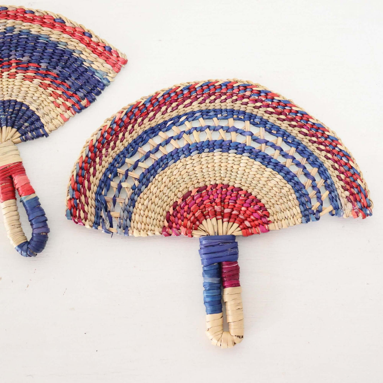 LA LA VAN – Handwoven Fan (Wall Hanging & Hand Fan) showcasing vibrant multicolour patterns and natural fibres.