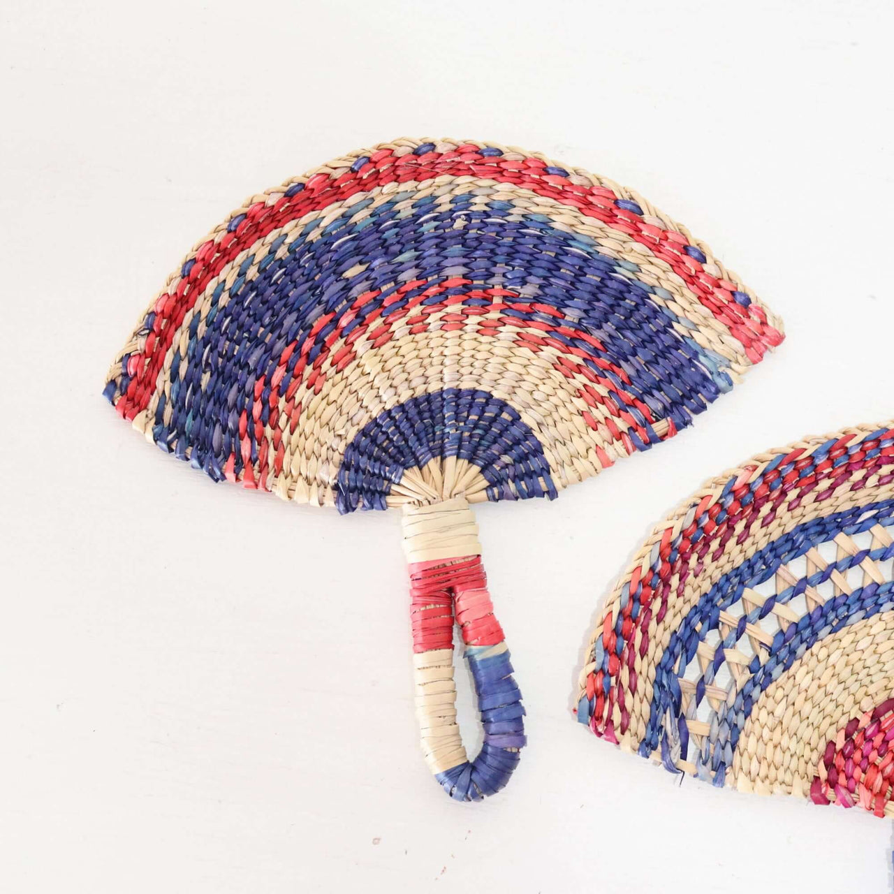 LA LA VAN – Handwoven Fan (Wall Hanging & Hand Fan) showcasing vibrant multicolour patterns and natural fibres.