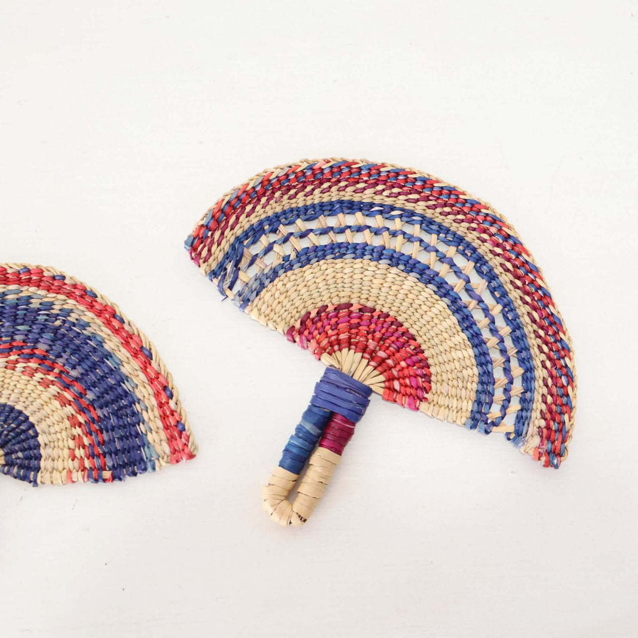 LA LA VAN – Handwoven Fan (Wall Hanging & Hand Fan) showcasing colorful, artisan-crafted patterns and natural fibres.