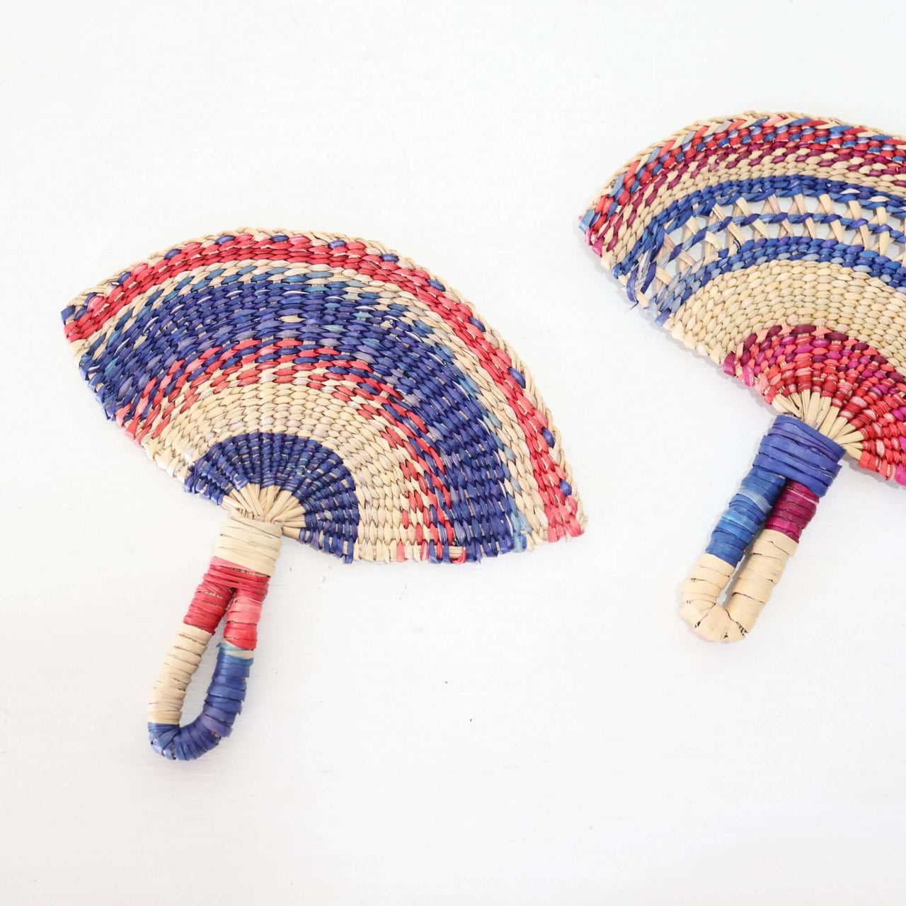 LA LA VAN – Handwoven Fan (Wall Hanging & Hand Fan) featuring vibrant multicolour patterns and a wrapped handle.