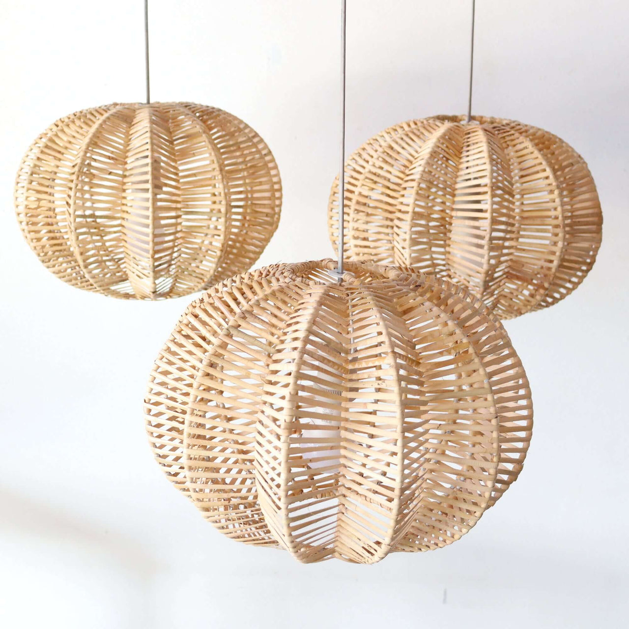 PALAVEE — rattan pendant light above a dining table for warm ambient glow
