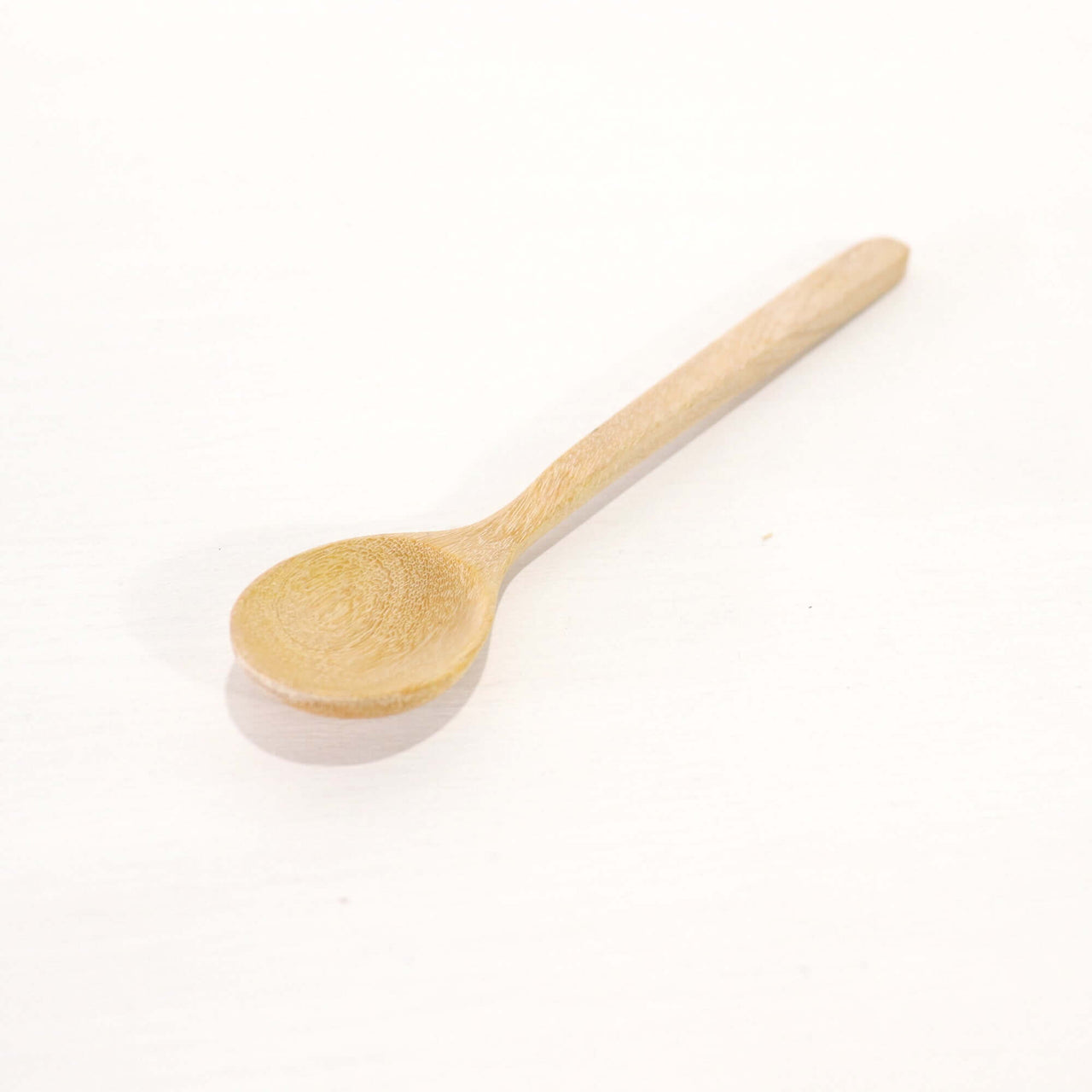 SU THI MA Wooden Honey Spoon on a white background, showcasing its handcrafted design.