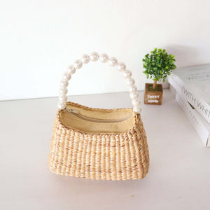 KI RA NA - Woven Straw Top Handle Bag Elevate your fashion game with the KI RA NA Straw Top Handle Bag. Perfect for any occasion, this eco-friendly and stylish accessory is a testament to sophisticated, sustainable fashion. Discover the perfect blend of d