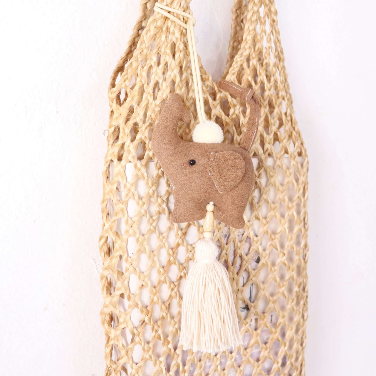 KADARA — handwoven tassel bag charm with a natural boho finish