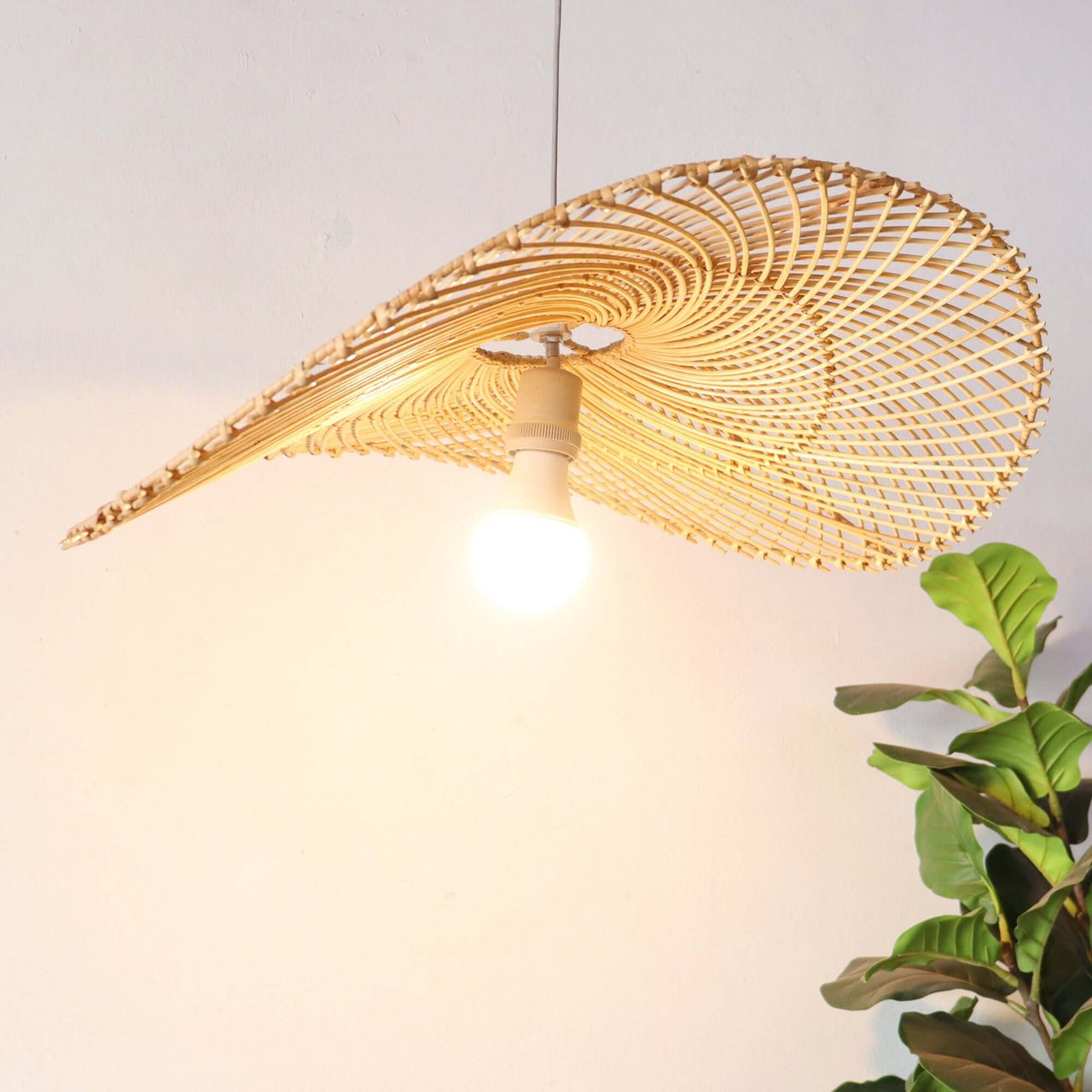 IYARA — rattan pendant light shade above a dining table for warm ambient glow