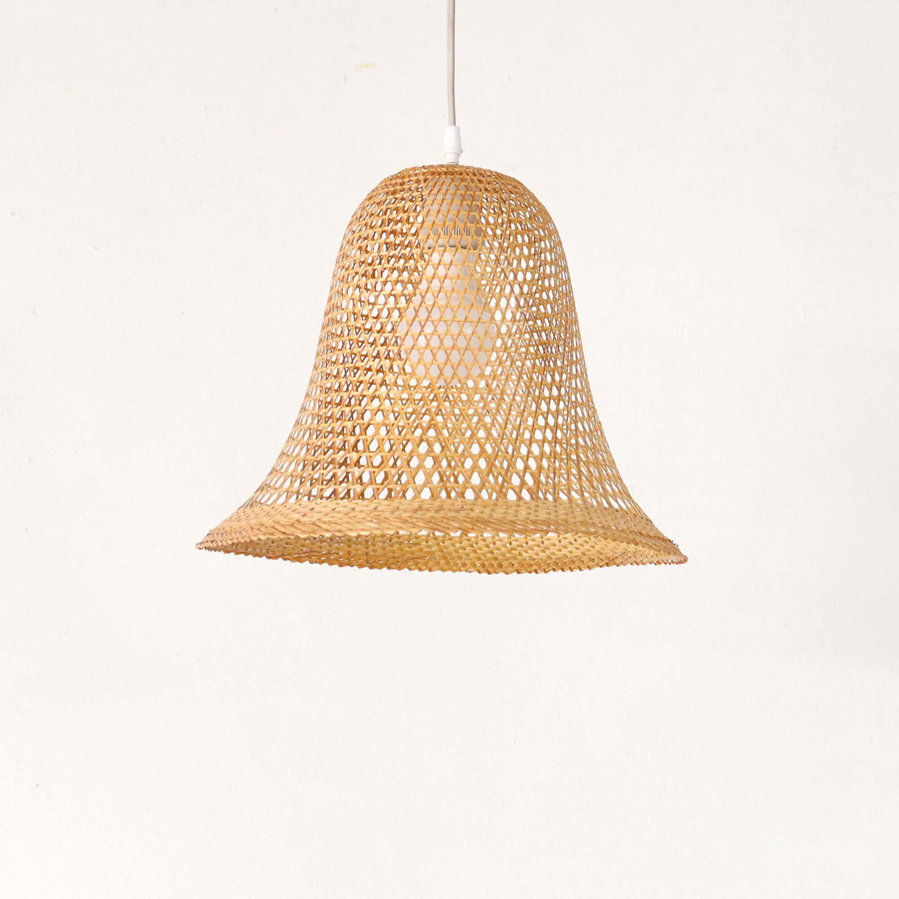 WANA — handwoven bamboo pendant light with an open weave that diffuses soft golden light