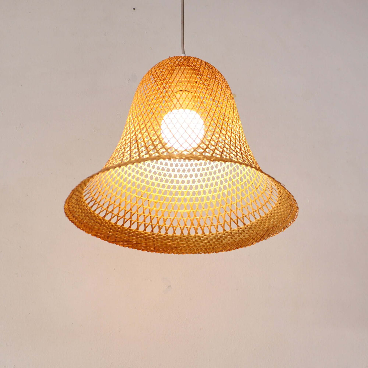 WANA — bamboo pendant light above a dining table for warm ambient glow