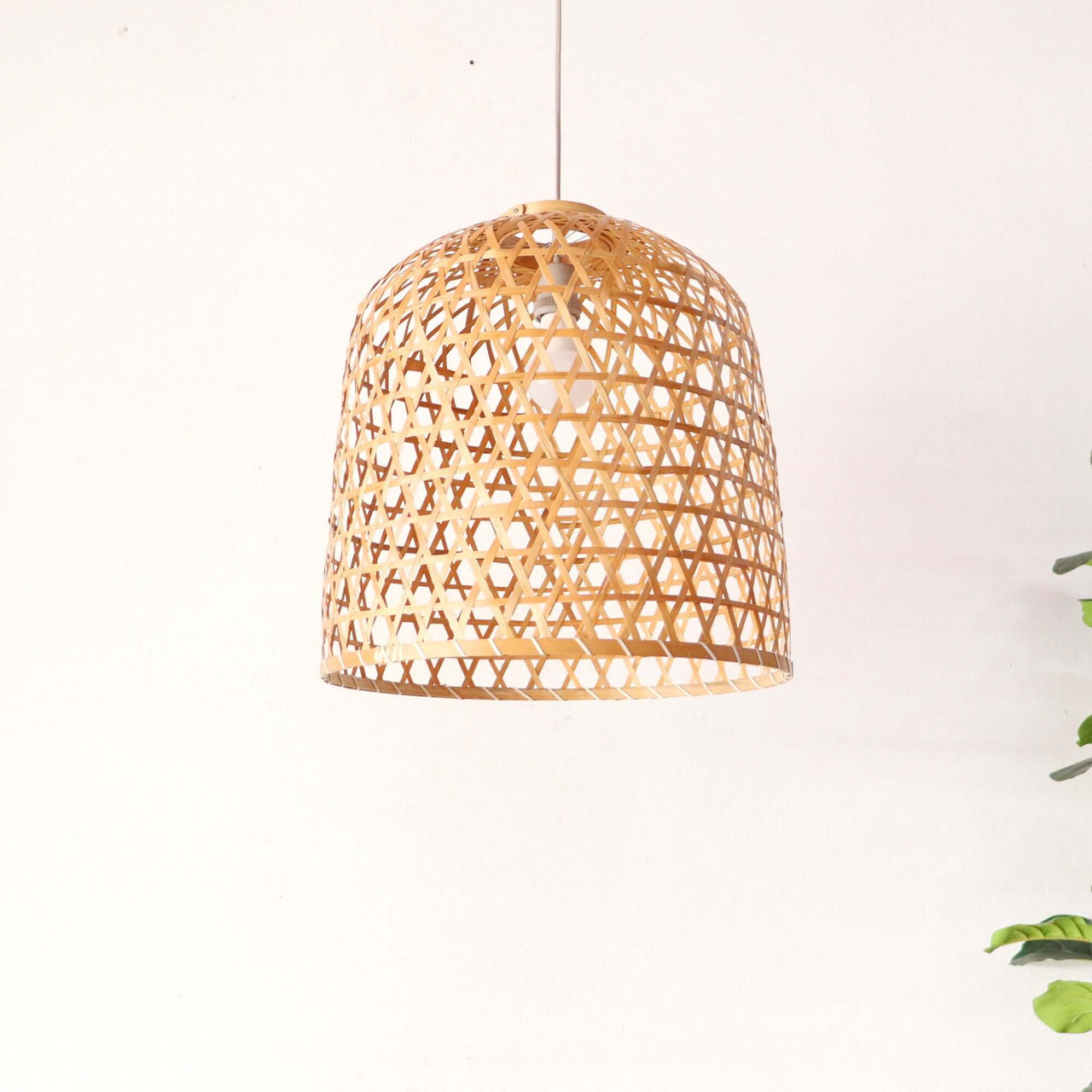 LAWAN — bamboo pendant light above a dining table for warm ambient glow