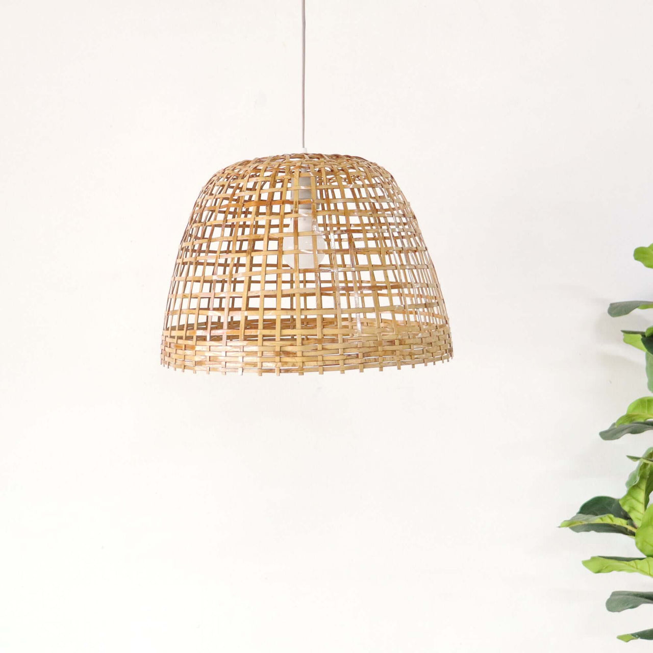 PIAREE — bamboo pendant light above a dining table for warm ambient glow