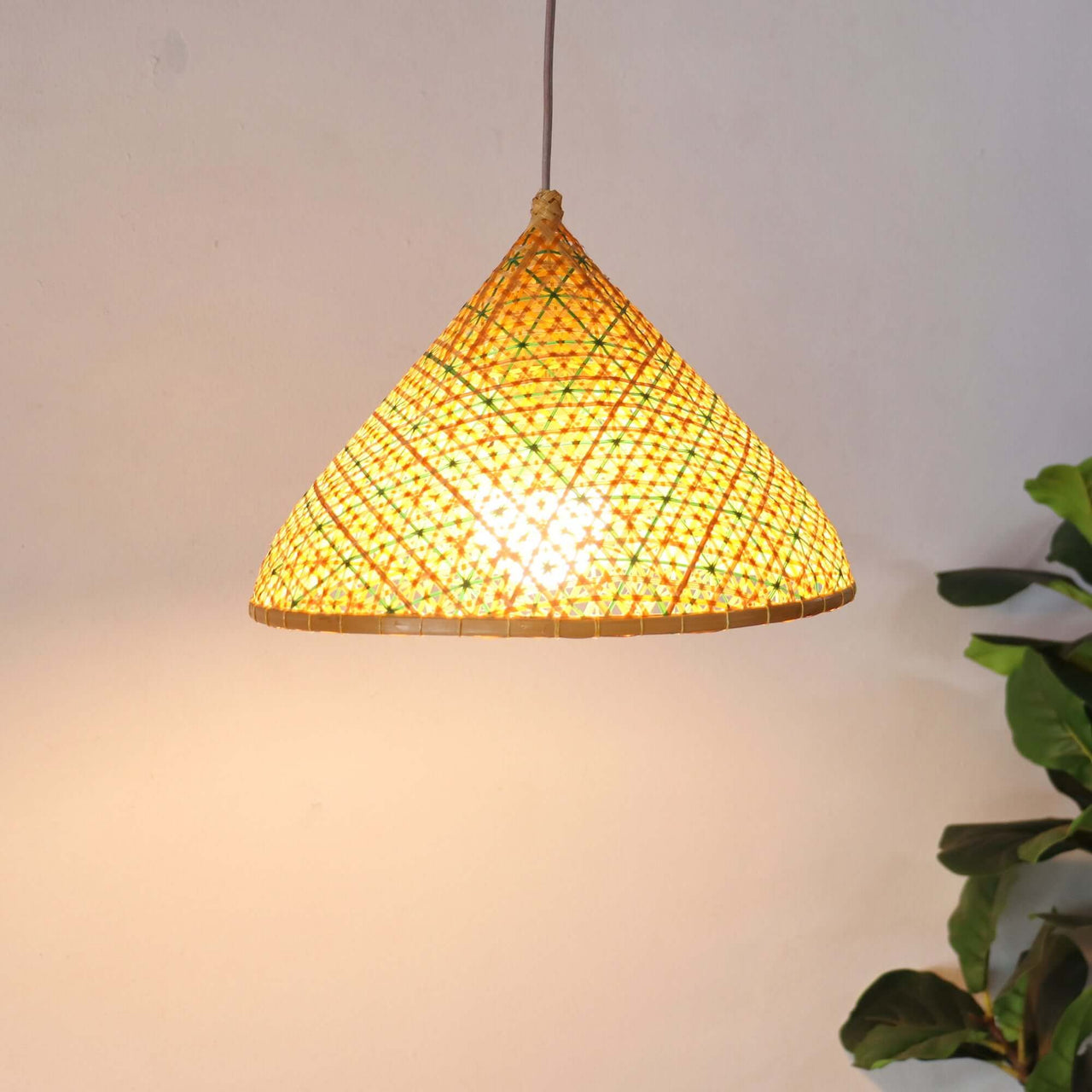 LALEE — handwoven bamboo pendant light with an open weave that diffuses soft golden light