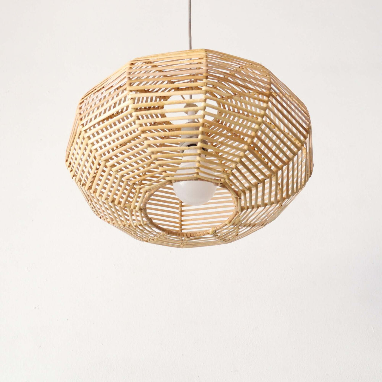 KAN WIN — rattan pendant light casting naturally diffused light