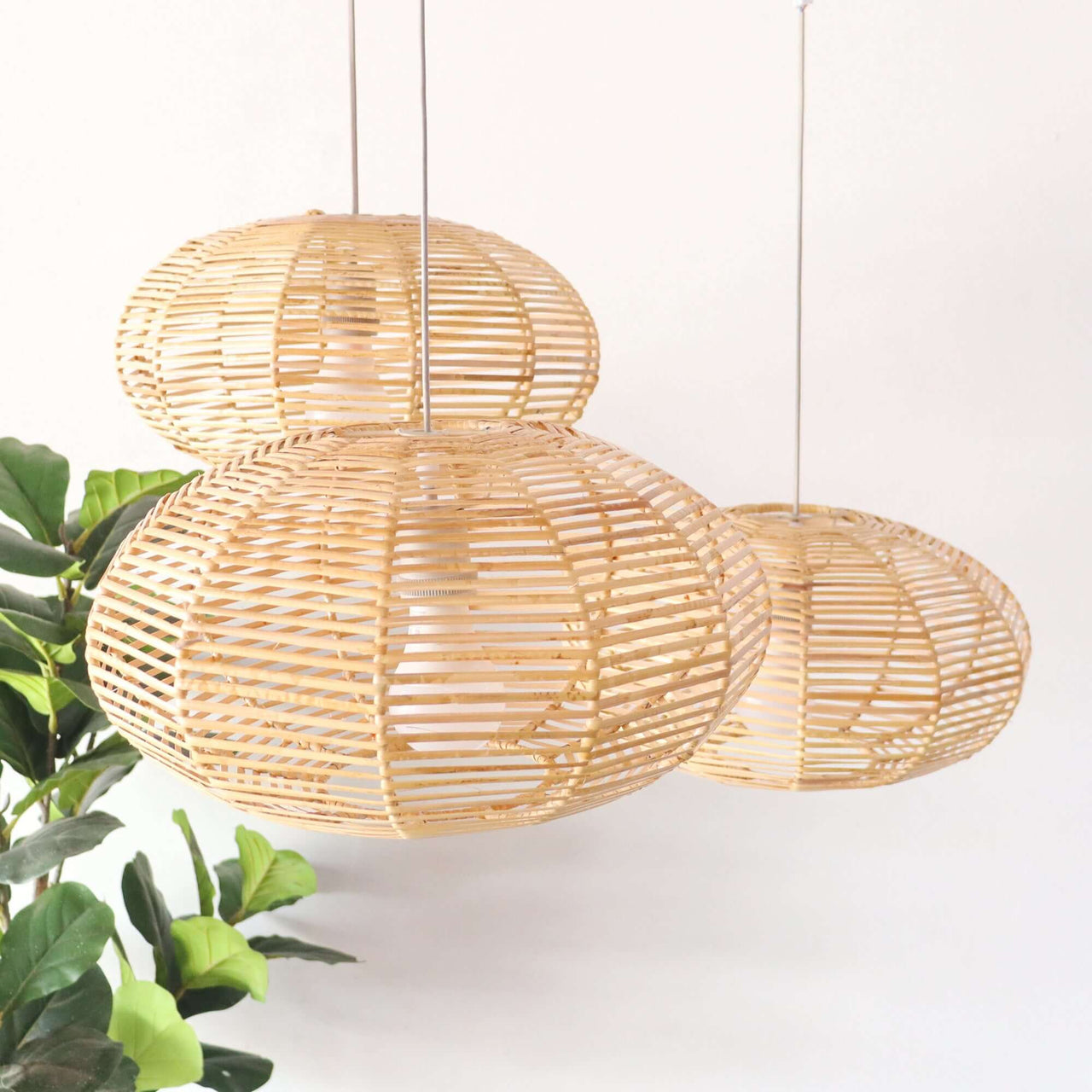 KAN WIN — rattan pendant light above a dining table for warm ambient glow