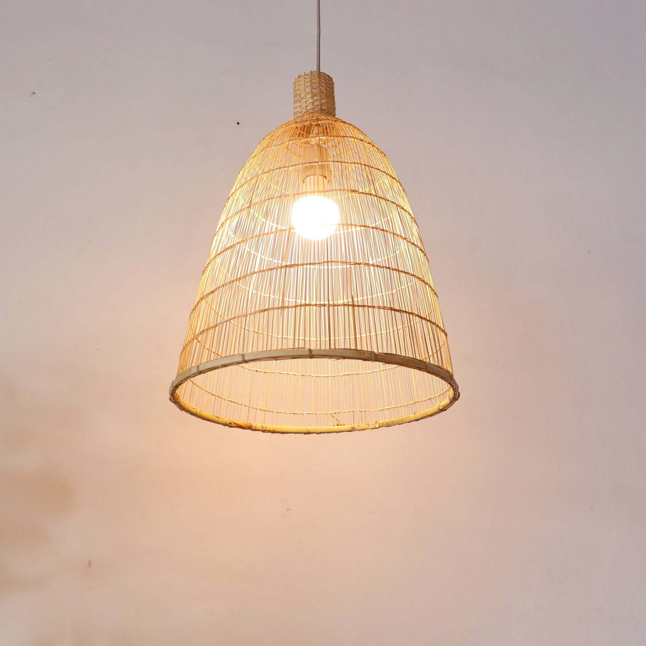 Bamboo pendant light shade casting naturally diffused light