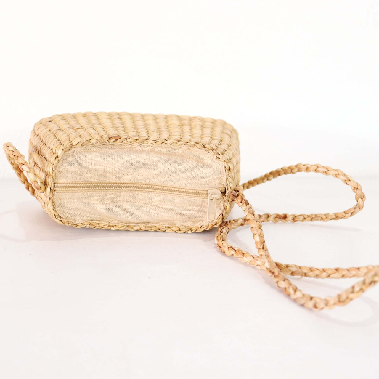 SARI PA PON - Cross Body Bag, compact and stylish with a braided strap and zipper closure.