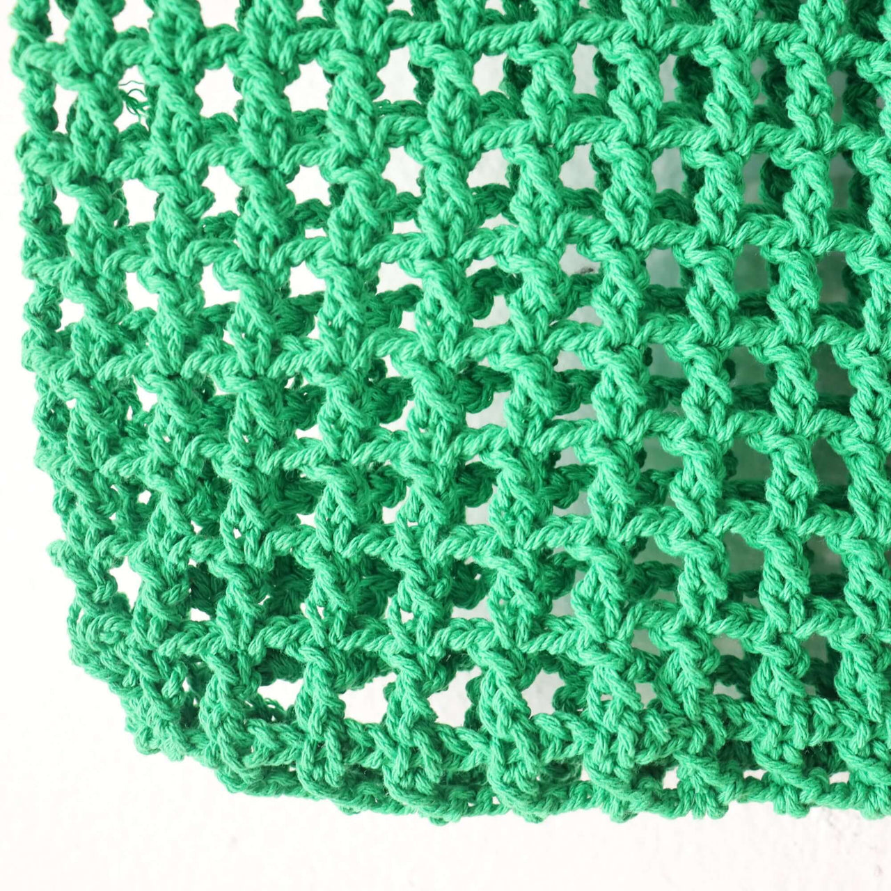 Green Crochet Bag — straw handbag styled for summer beach outings
