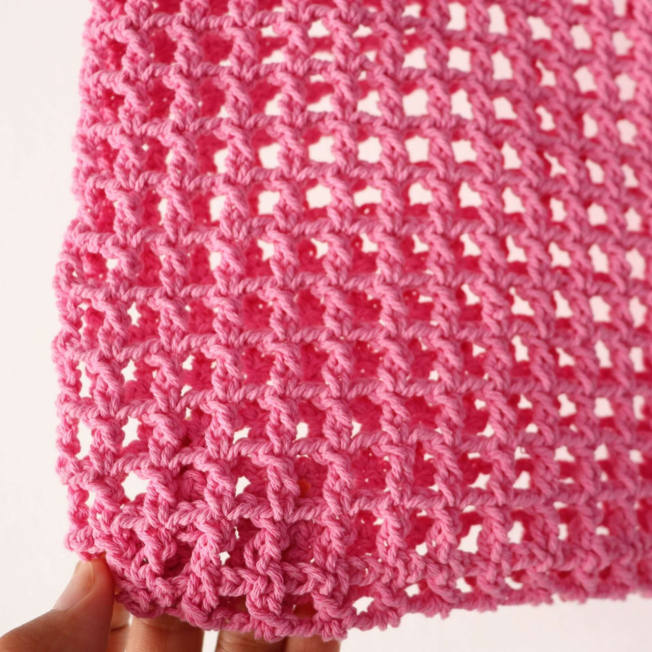 Pink Crochet — straw handbag styled for summer beach outings