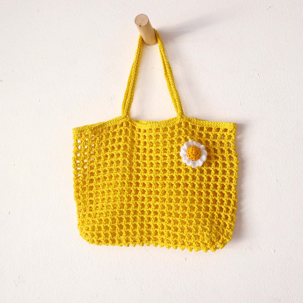 Yellow — handwoven straw handbag with a soft, natural weave