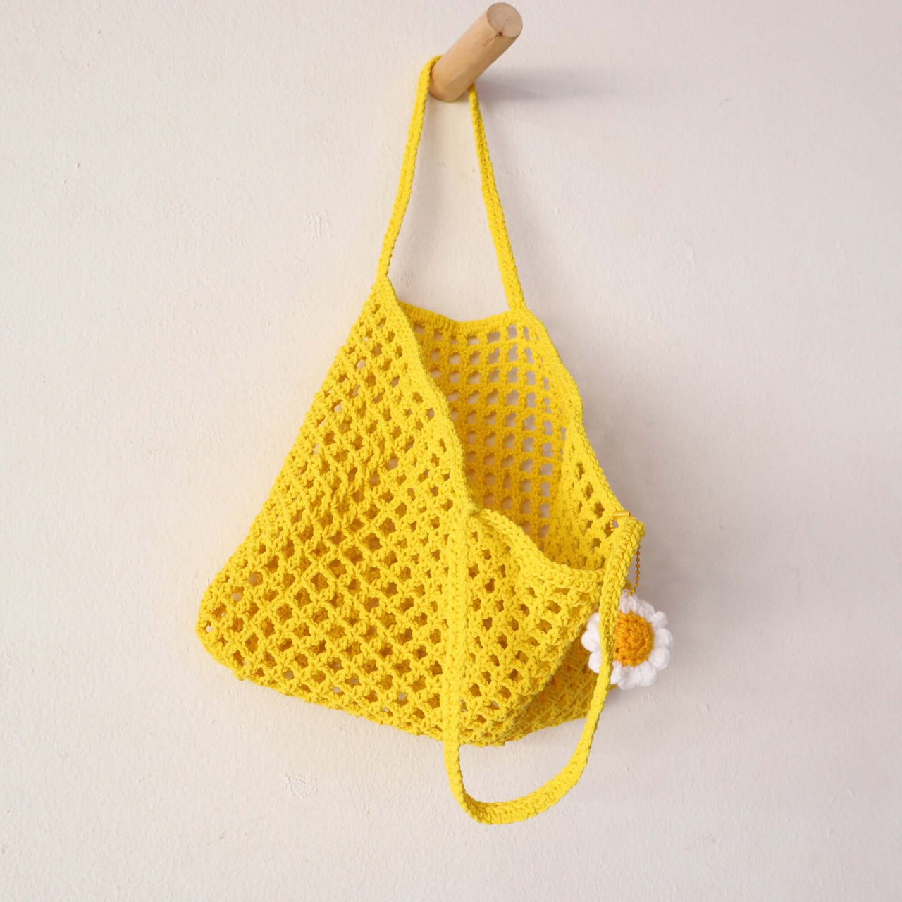 Yellow — straw handbag styled for summer beach outings