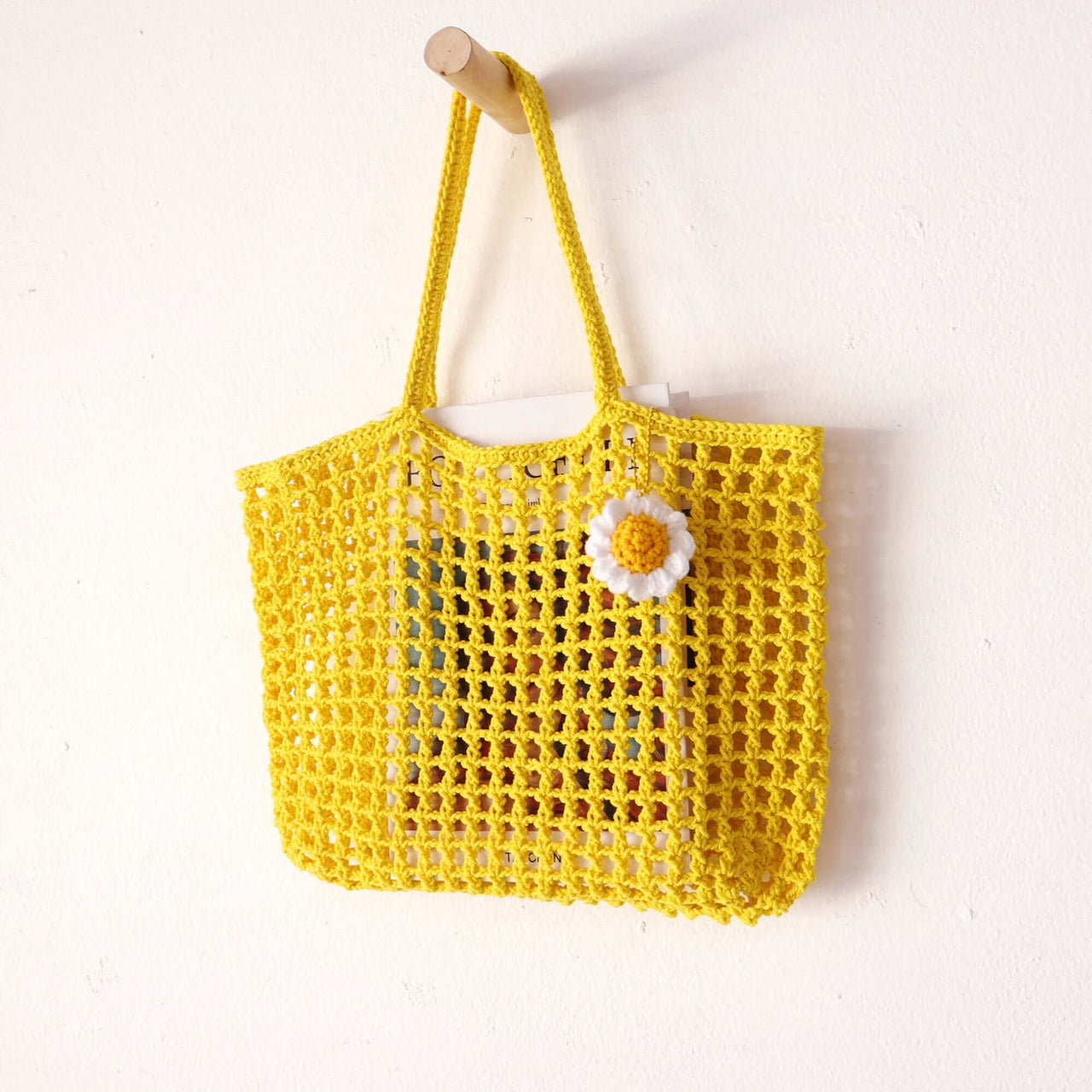 Yellow — straw handbag with a relaxed, vacation-ready look
