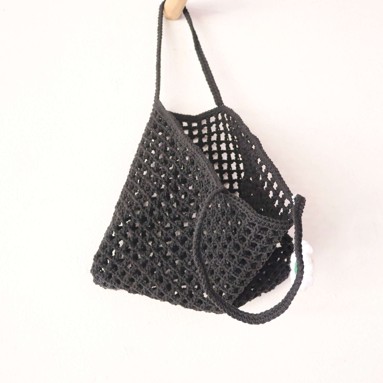 Black Crochet Bag — straw handbag styled for summer beach outings