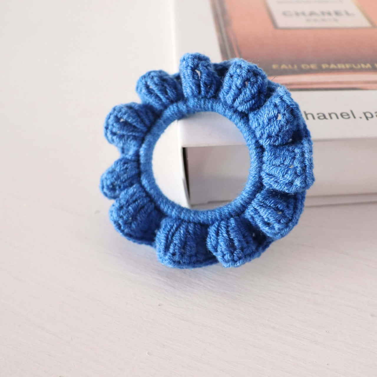 Blue hand-crochet scrunchie showcasing textured design and soft color from the Purple Tones - Hand Crochet Scrunchies collection.