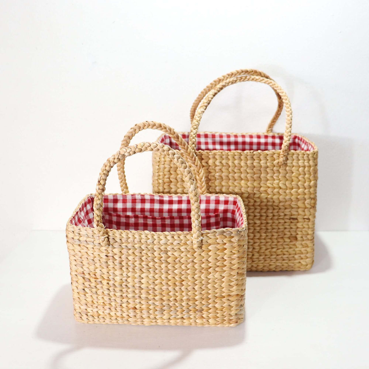 Handwoven straw basket bag with natural woven texture, by Thai artisans