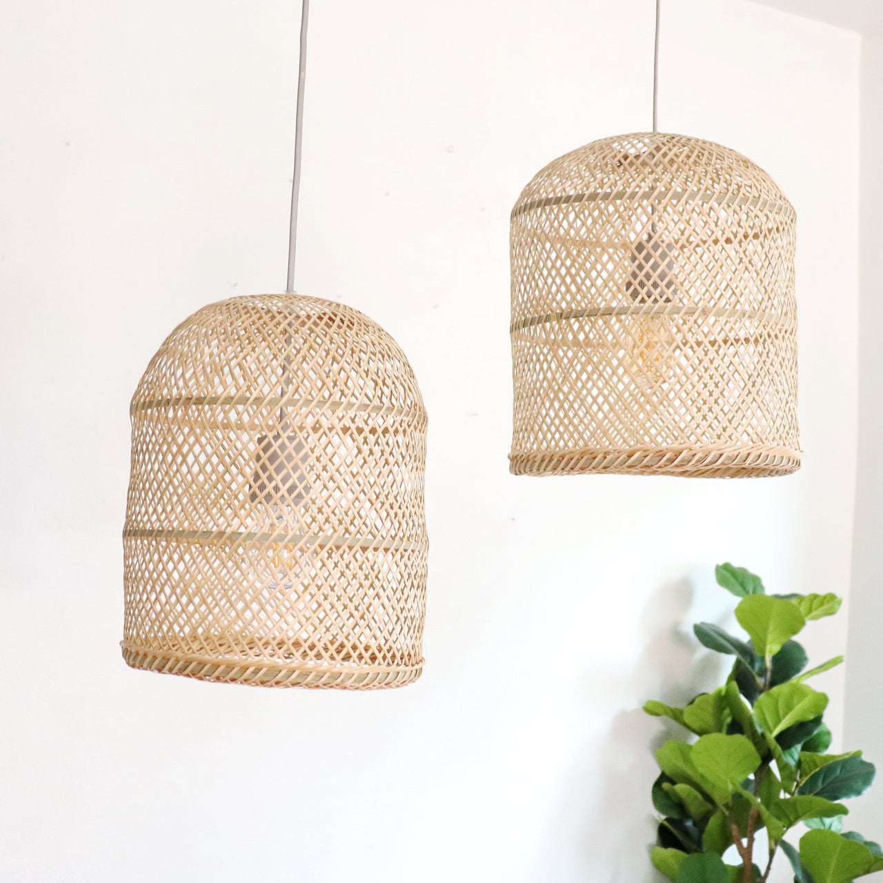 ARUN — handwoven bamboo pendant light shade with an open weave that diffuses soft golden light