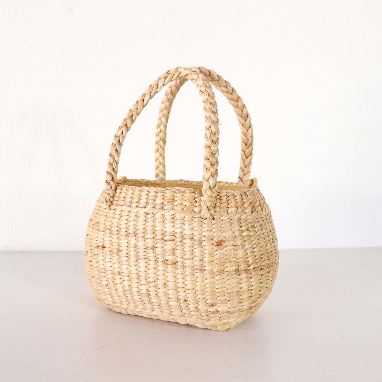 Nongpanee — straw basket bag that pairs with boho and resort outfits