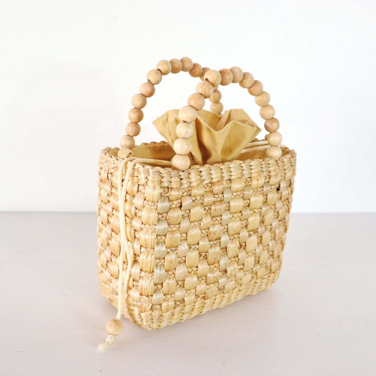Ratsame — natural straw handbag with an artisan woven finish