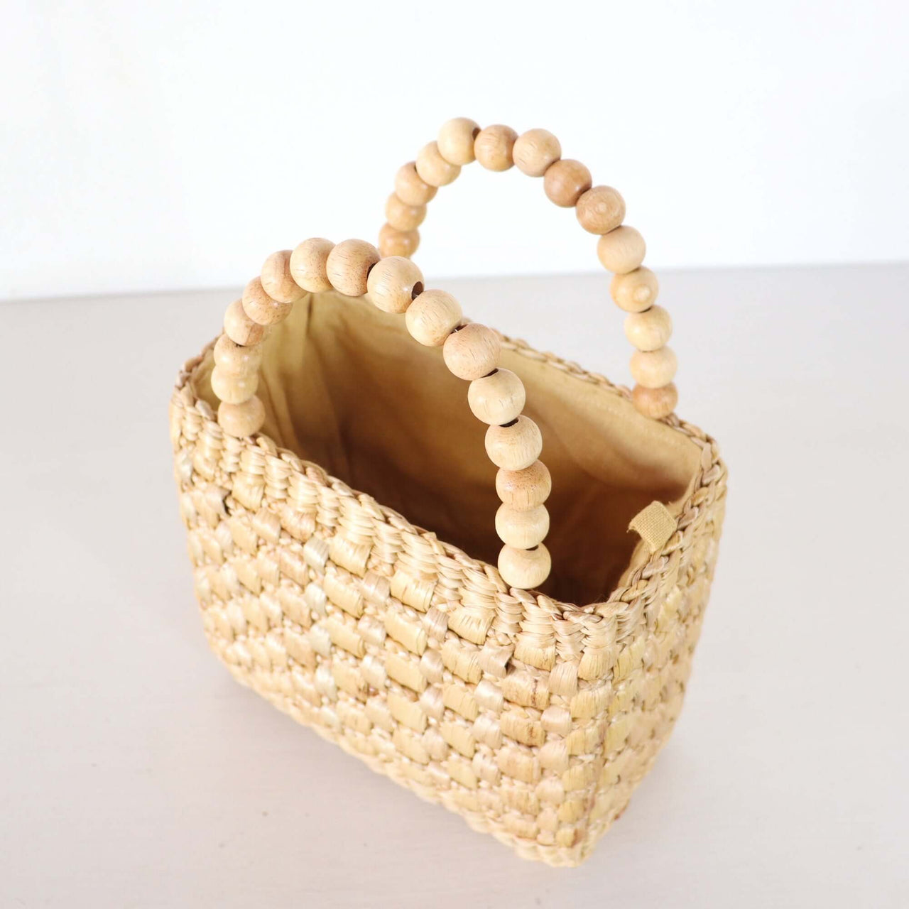 Ratsame — straw handbag in natural earthy tones