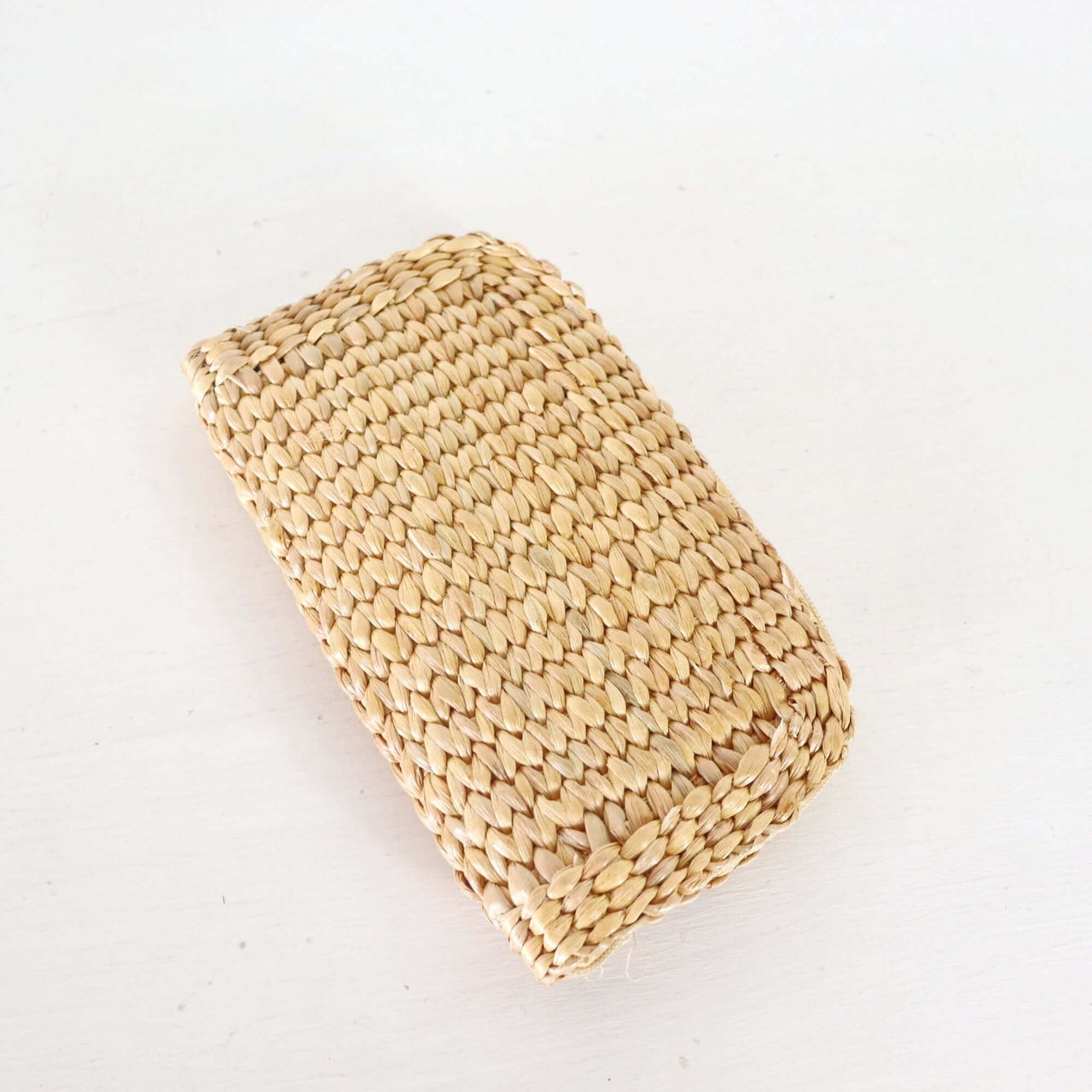 Mali — straw clutch bag styled for summer beach outings