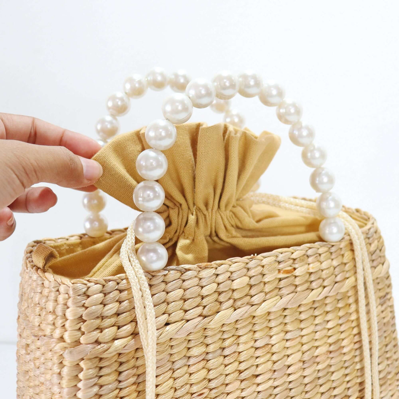 Lala — handwoven straw handbag with a soft, natural weave