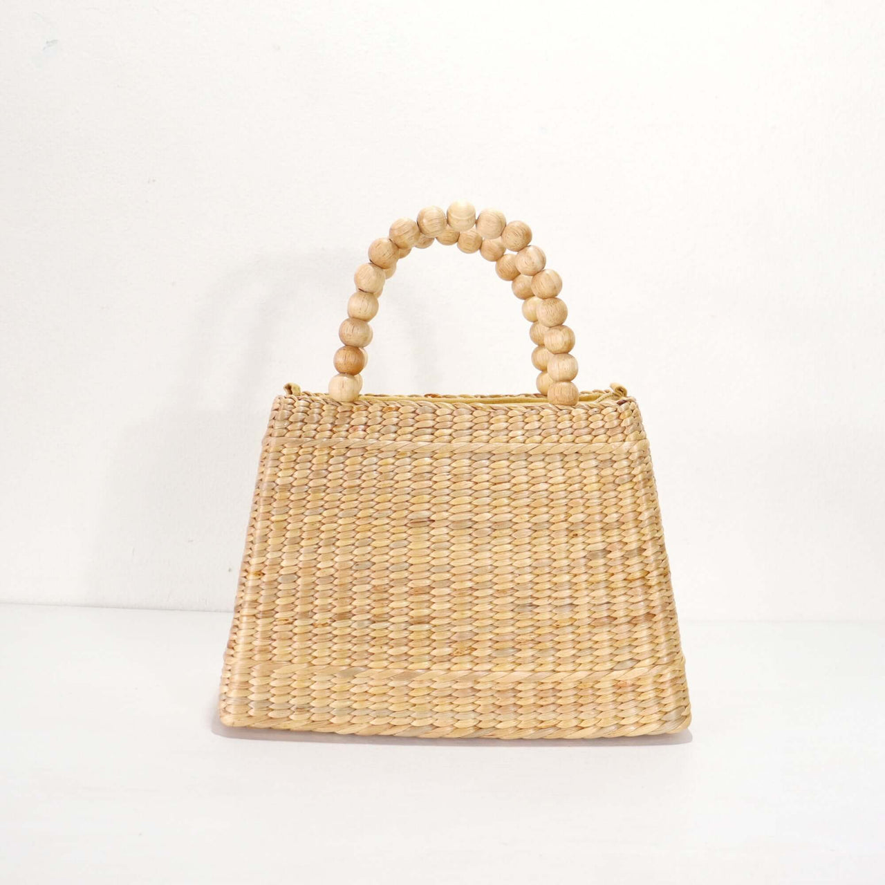 CHALA handwoven straw handbag with natural woven texture, by Thai artisans